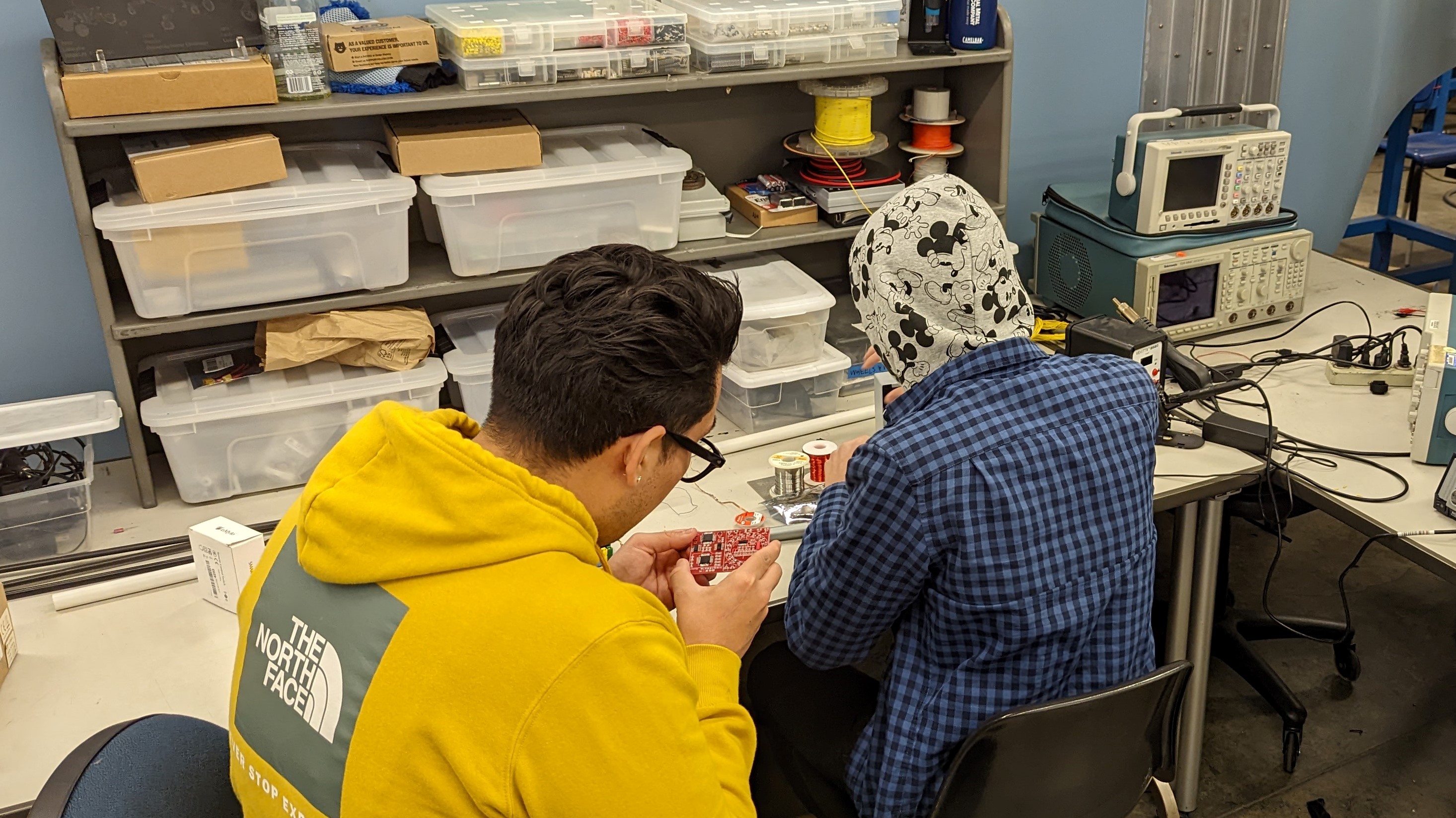 Picture of some of the Electrical members practicing soldering